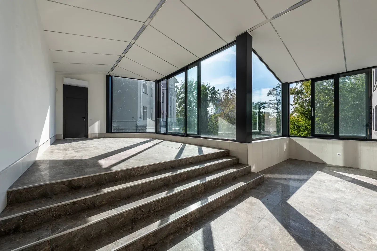 Large residential glass windows bringing daylight into an interior