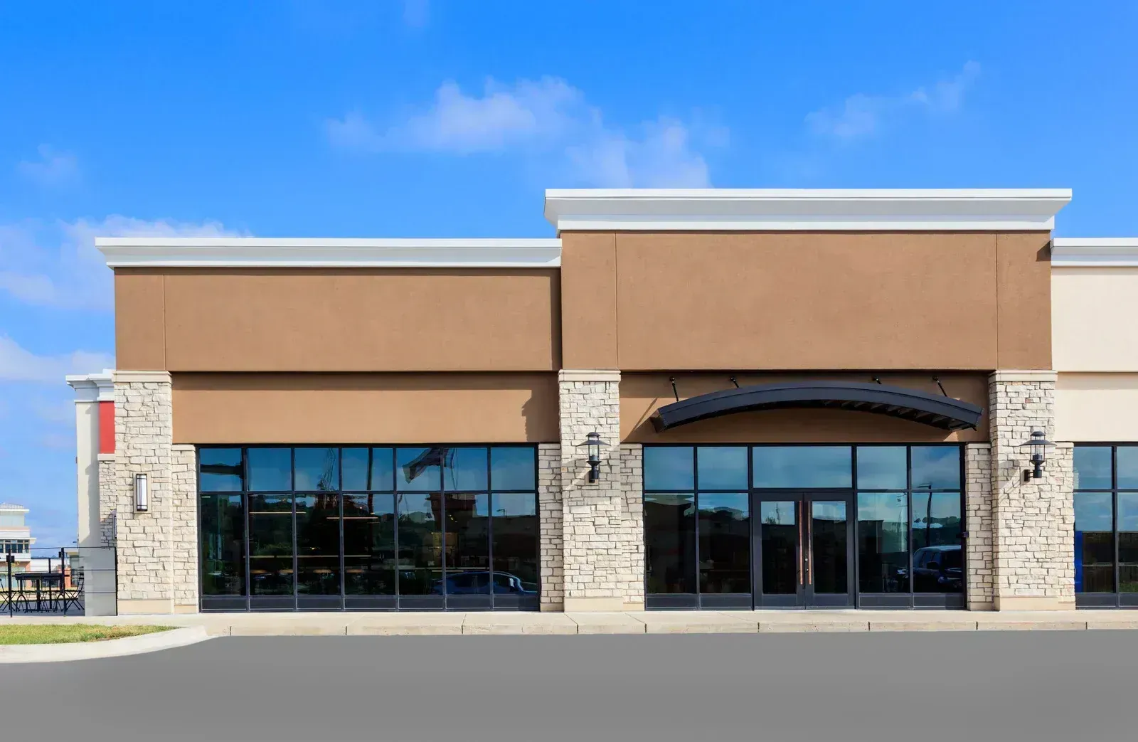 Commercial storefront with glass entrance doors and windows