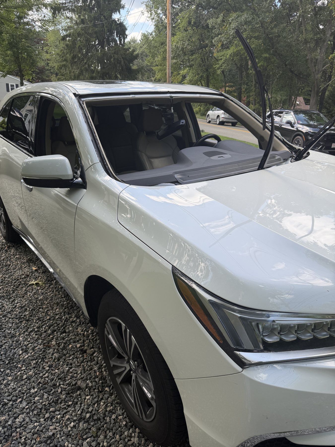 Windshield removed from a 2017 Acura MDX before replacement
