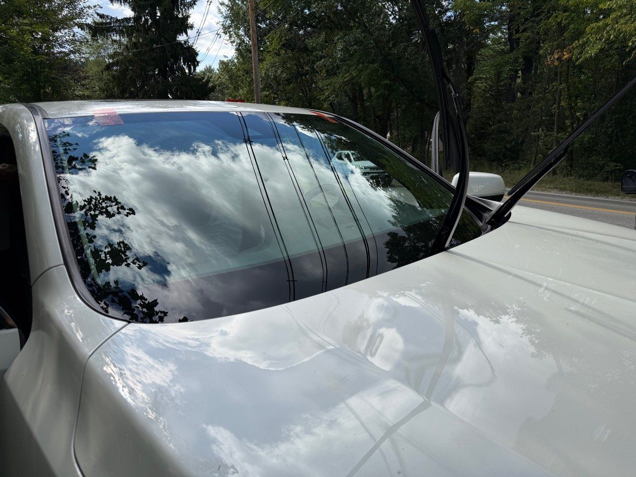 Completed windshield replacement on a 2017 Acura MDX with no tools resting on the vehicle