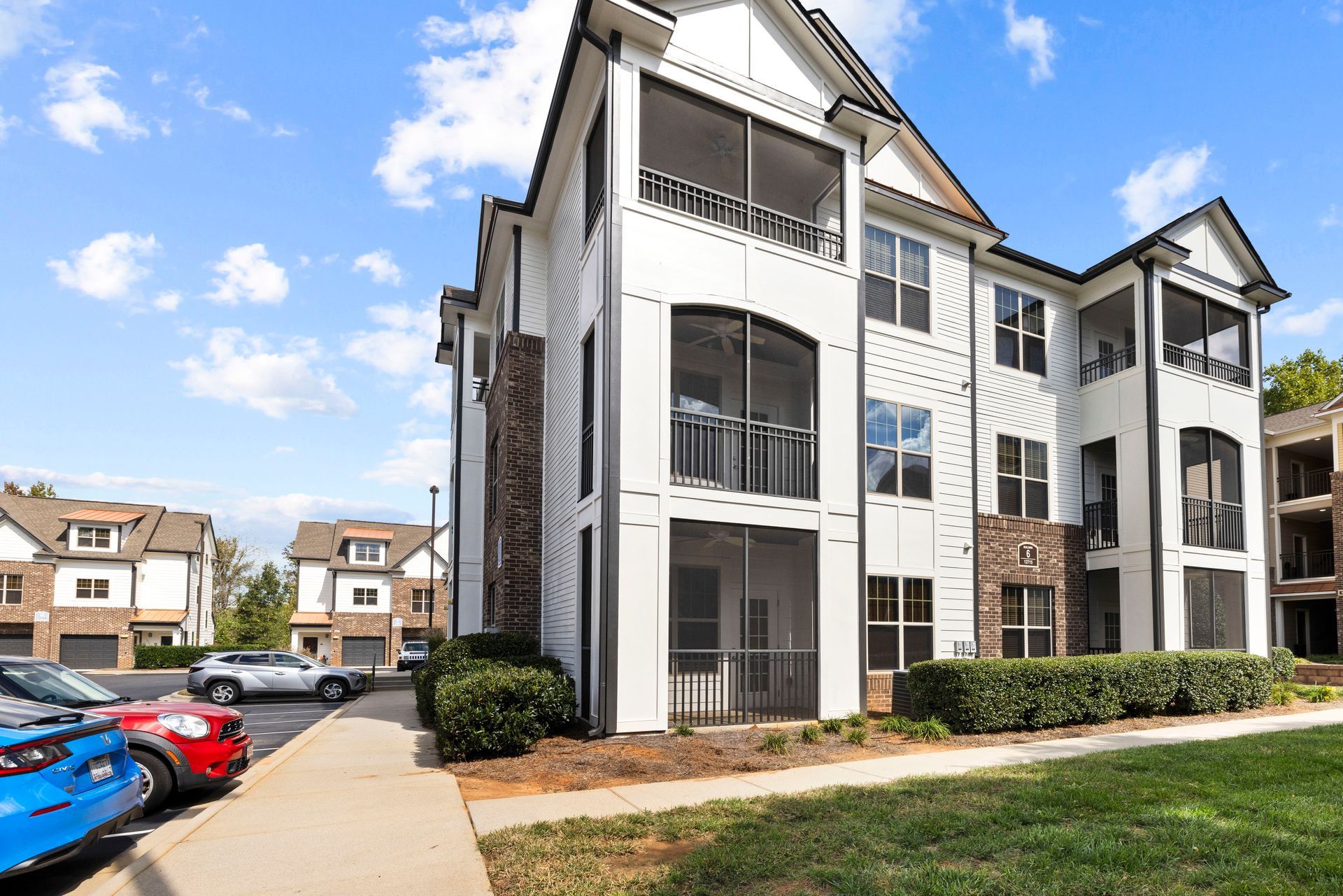 Silver Collection at Waterford apartment community with balconies, landscaped grounds, and resident parking in Huntersville, NC.