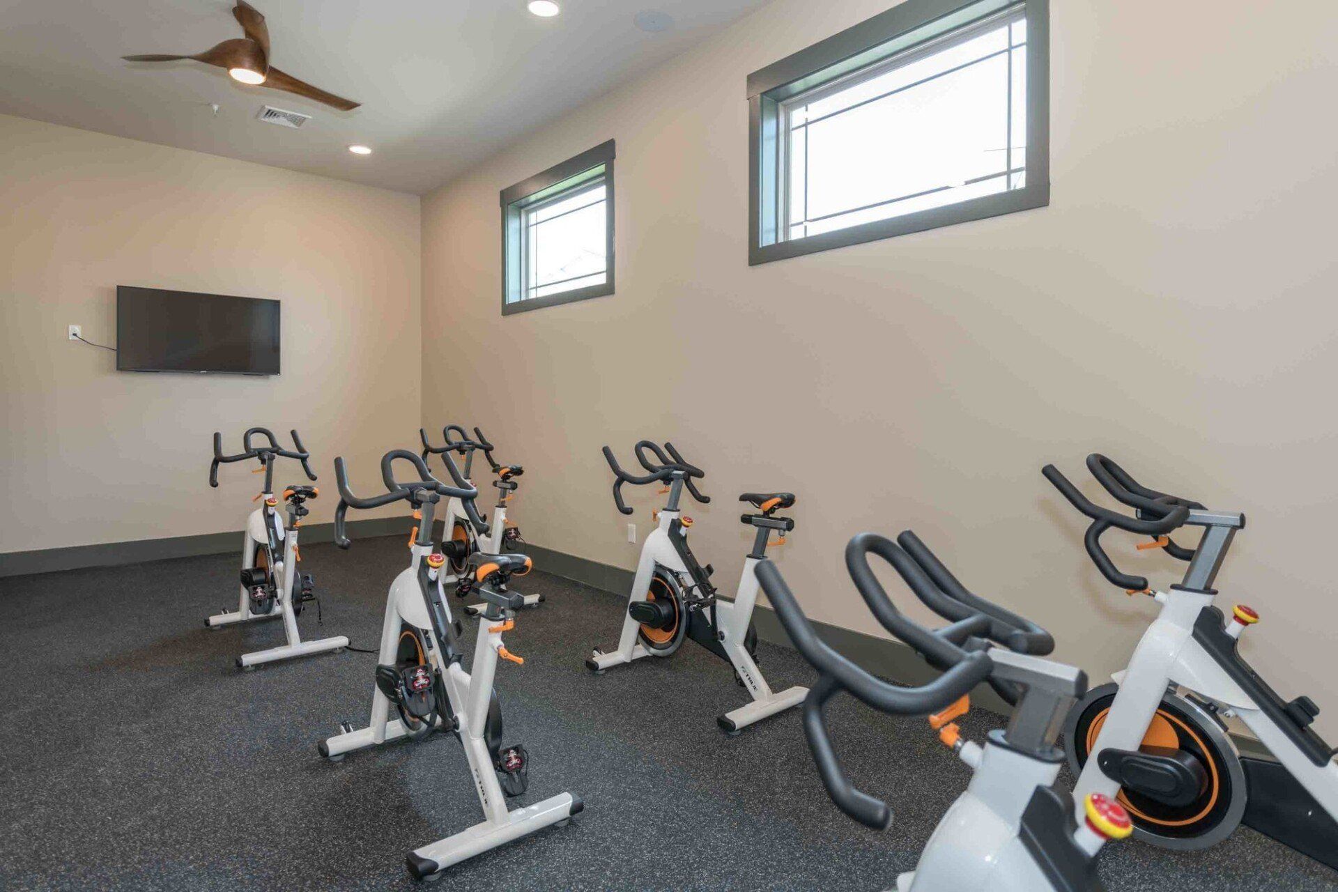 Silver Collection at Celebrate fitness center with a row of exercise bikes and modern workout equipment in Fredericksburg, VA.