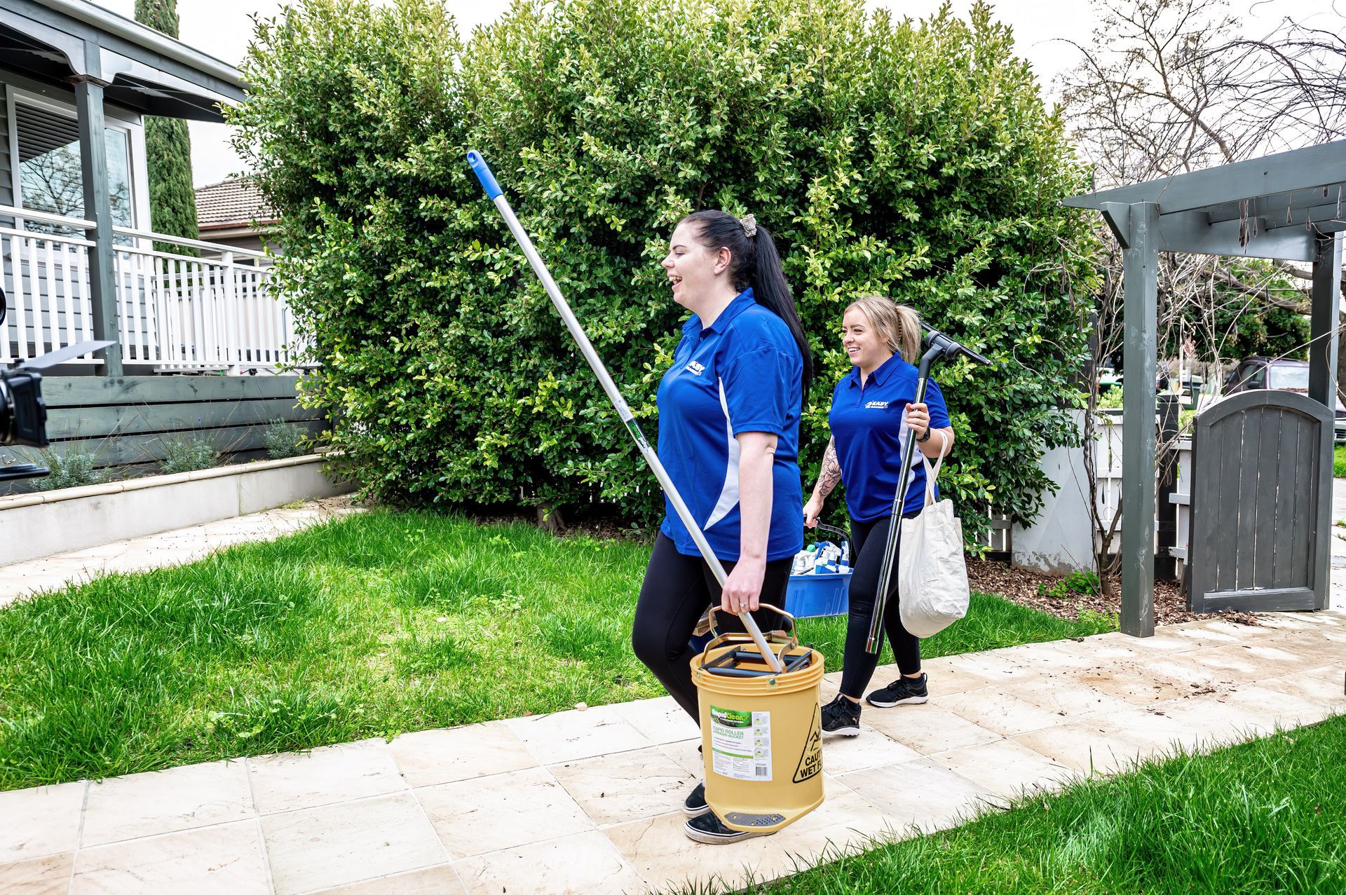 A Person Is Using A Lawn Mower To Cut The Grass — 2easy Cleaning in Castlemaine, VIC