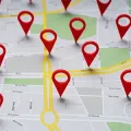 Map with multiple red location pins marking destinations on streets and highways