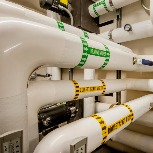 A bunch of pipes with one that says domestic water on it