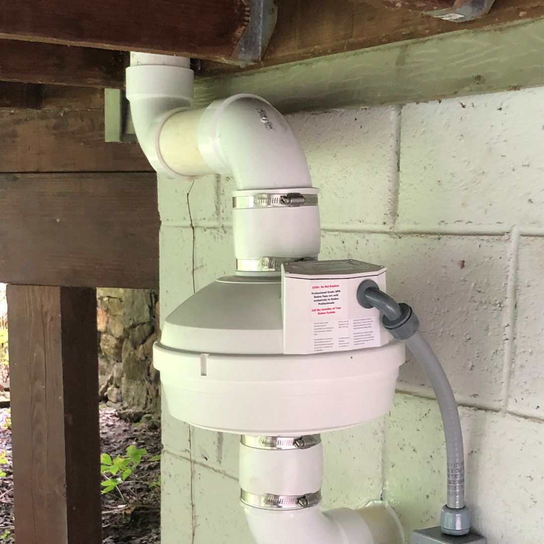 radon fan hidden beneath outdoor deck