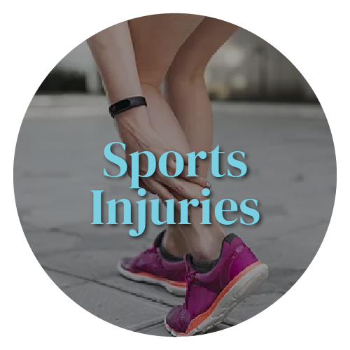 A person is holding their ankle in pain.