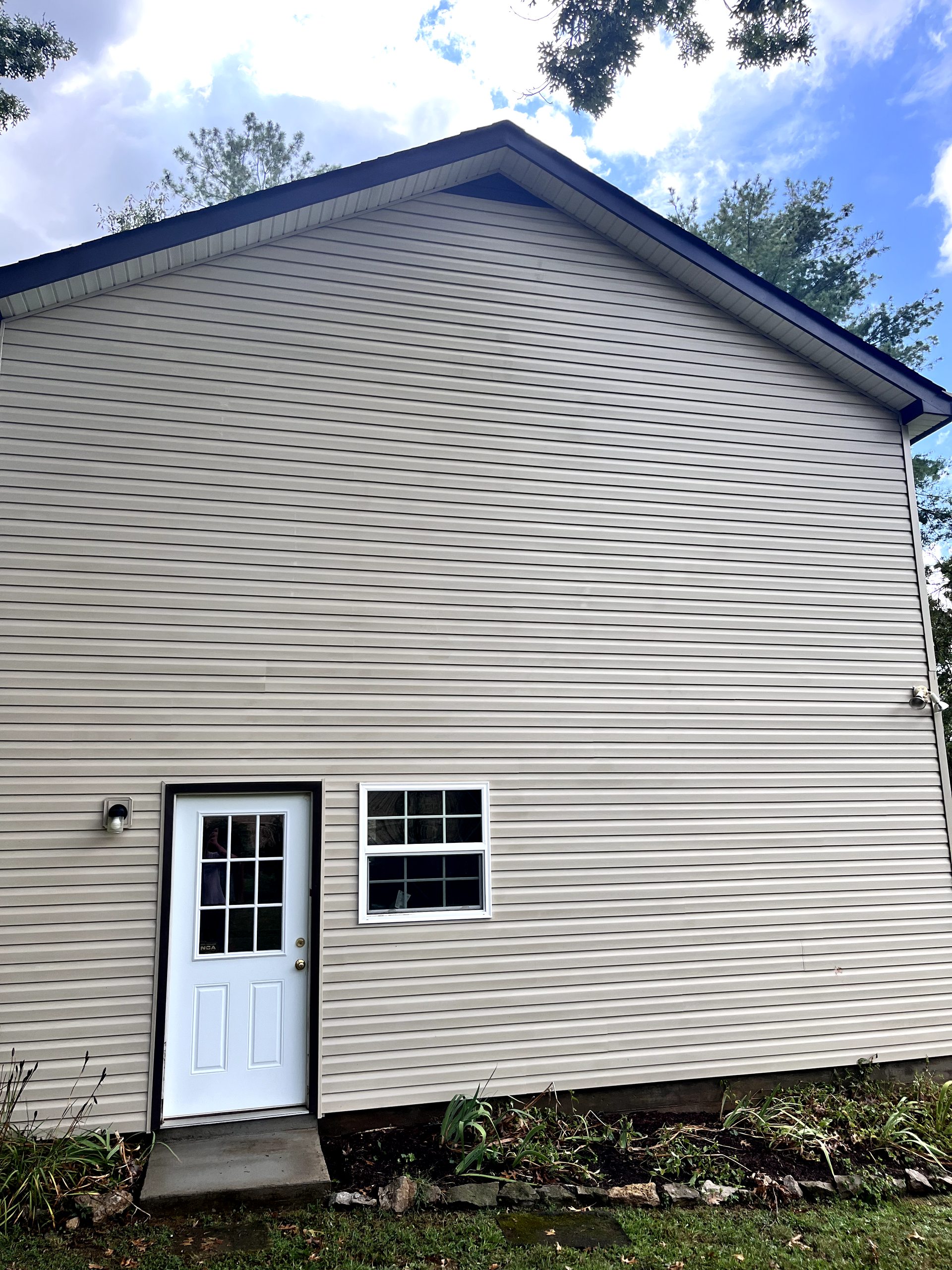 A white house with a white door and windows