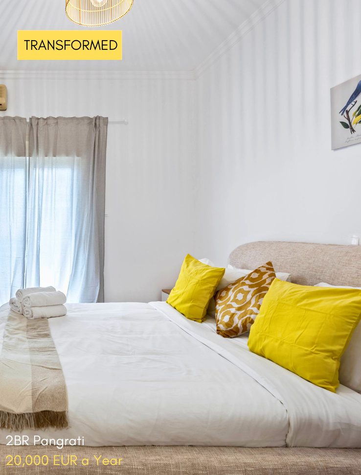 Bright styled room with sheer curtains after a Cheez Hospitality interior transformation in Athens