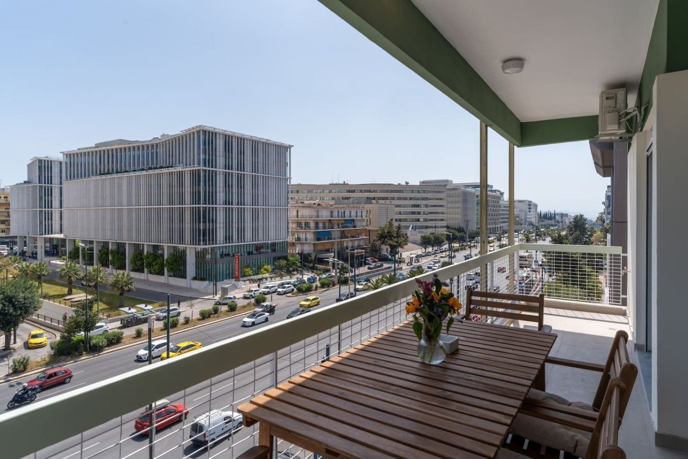 Balcony over an Athens avenue lined with apartment and office buildings, at Ofi Continental, operated by Cheez Hospitality
