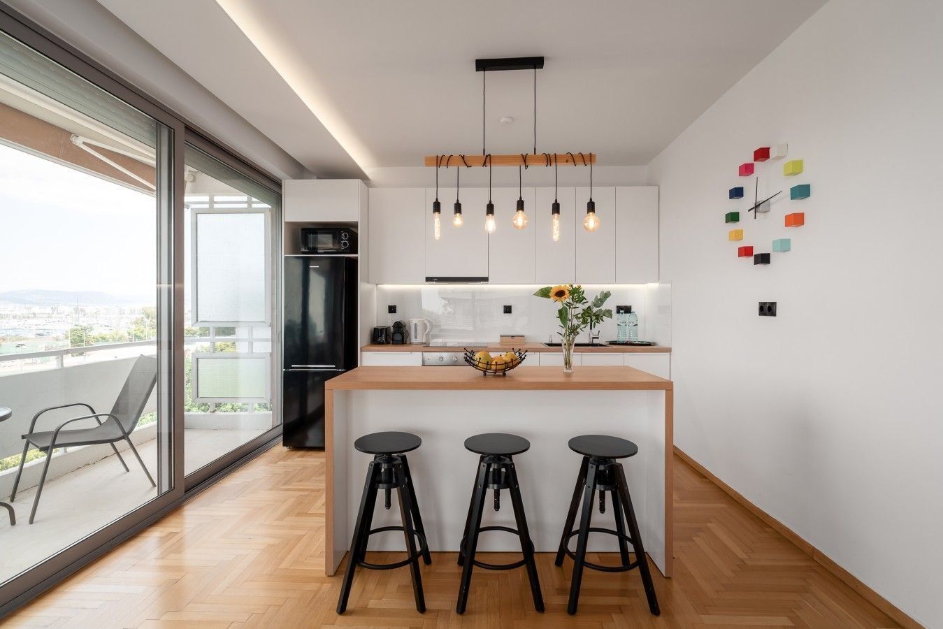 Kitchen with island and pendant lights at Faliro Blue, Palaio Faliro, set up and operated by Cheez Hospitality