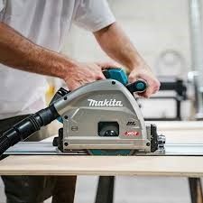 A group of tools are sitting on a wooden floor.