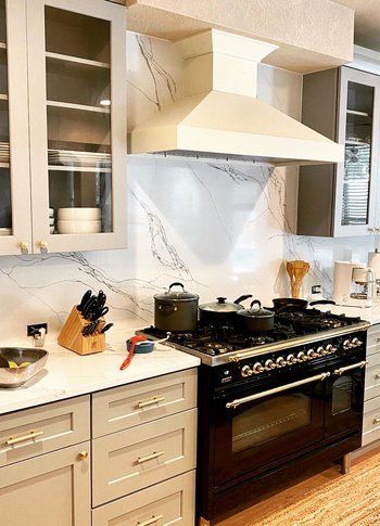 Home in Circle C neighborhood in southwest Austin, TX that had kitchen remodel including new cabinets, cabinet painting, new countertops, and new backsplash completed by Austin Painting and Cabinets