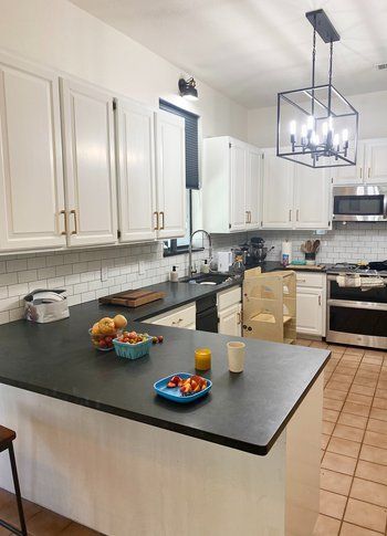 Home in Round Rock, TX that had kitchen remodel including cabinet painting, new countertops, and new backsplash completed by Austin Painting and Cabinets