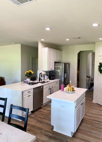 Home in Lake Travis area of Austin, TX that had kitchen remodel including cabinet painting and new countertops completed by Austin Painting and Cabinets
