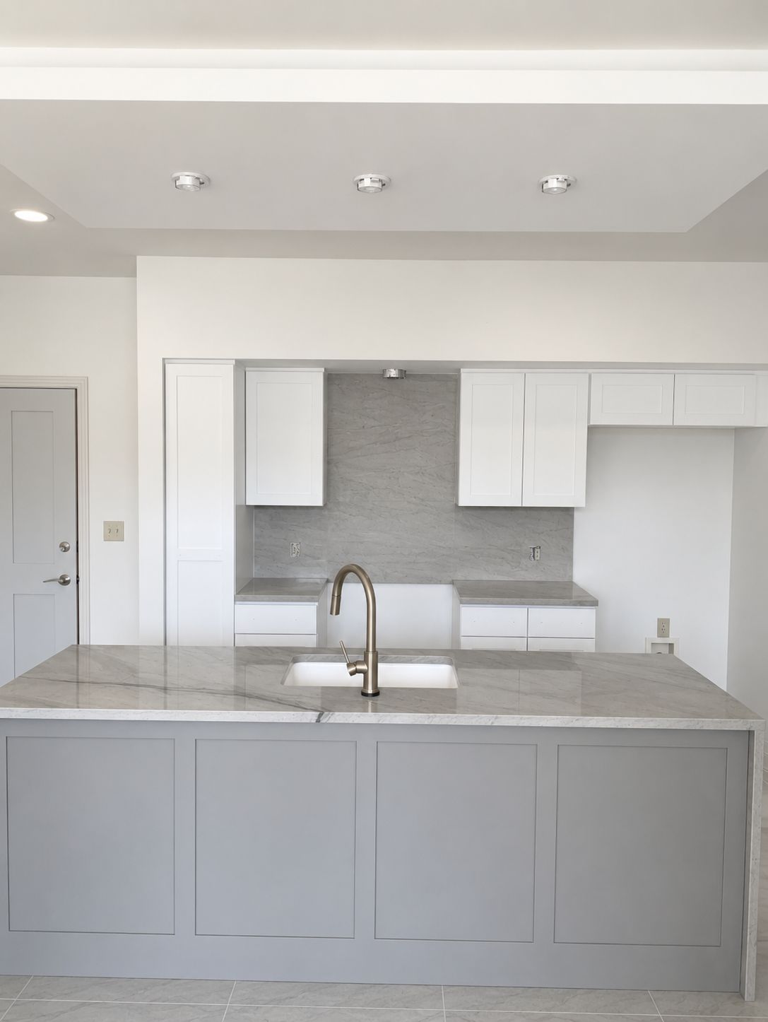 Barton Hills Austin kitchen remodel with quartz waterfall island and painted cabinets