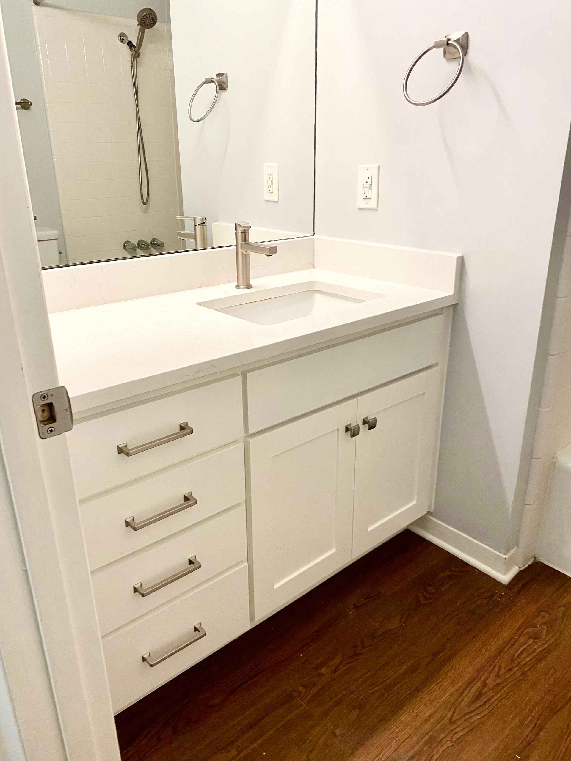 Bathroom cabinet refacing project in Austin with updated shaker cabinet doors