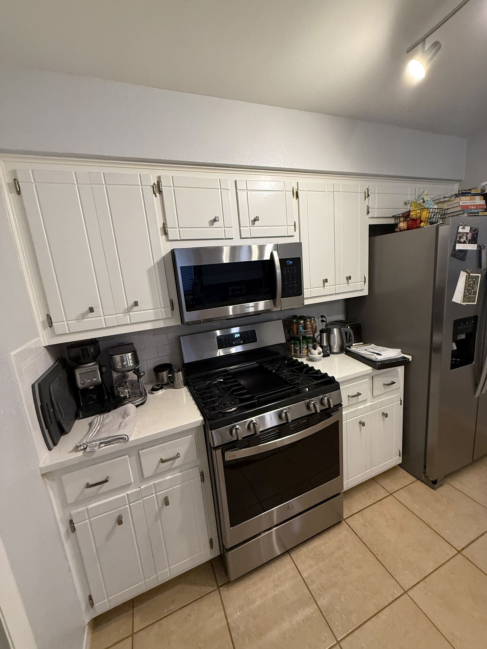 Austin kitchen cabinet refacing before photo in Bouldin Creek with outdated cabinet doors