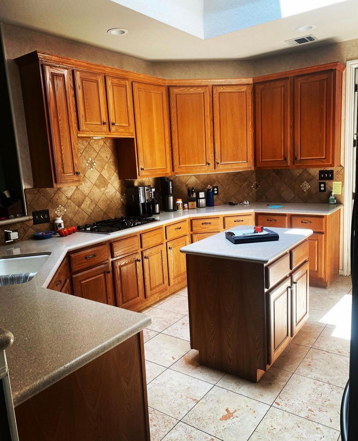 Cedar Park kitchen before remodel with raised bar top wallpaper and older cabinets