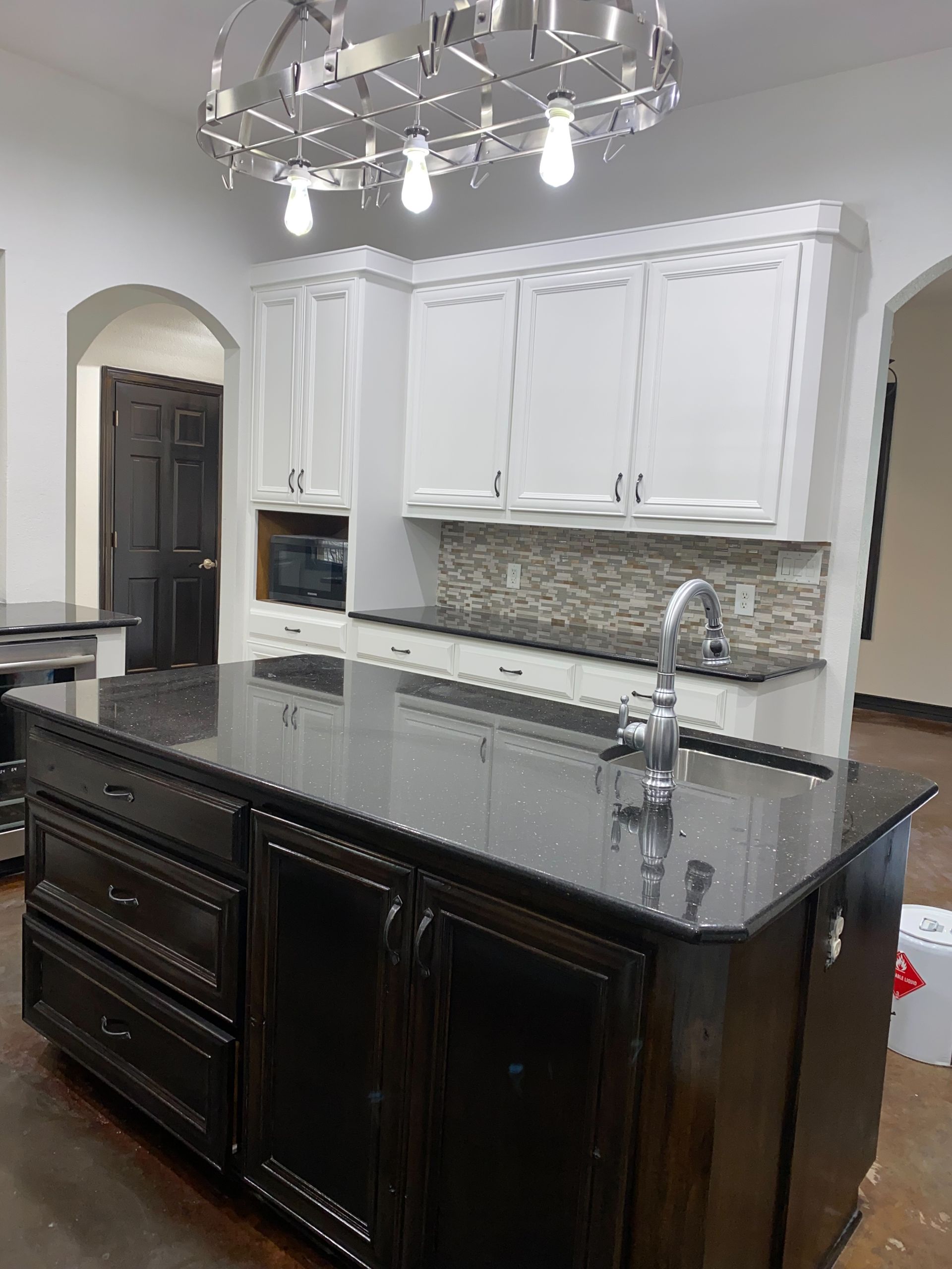 Cabinet painting and staining project in Jonestown Texas completed before the homeowner hired Austin Painting and Cabinets for their second home
