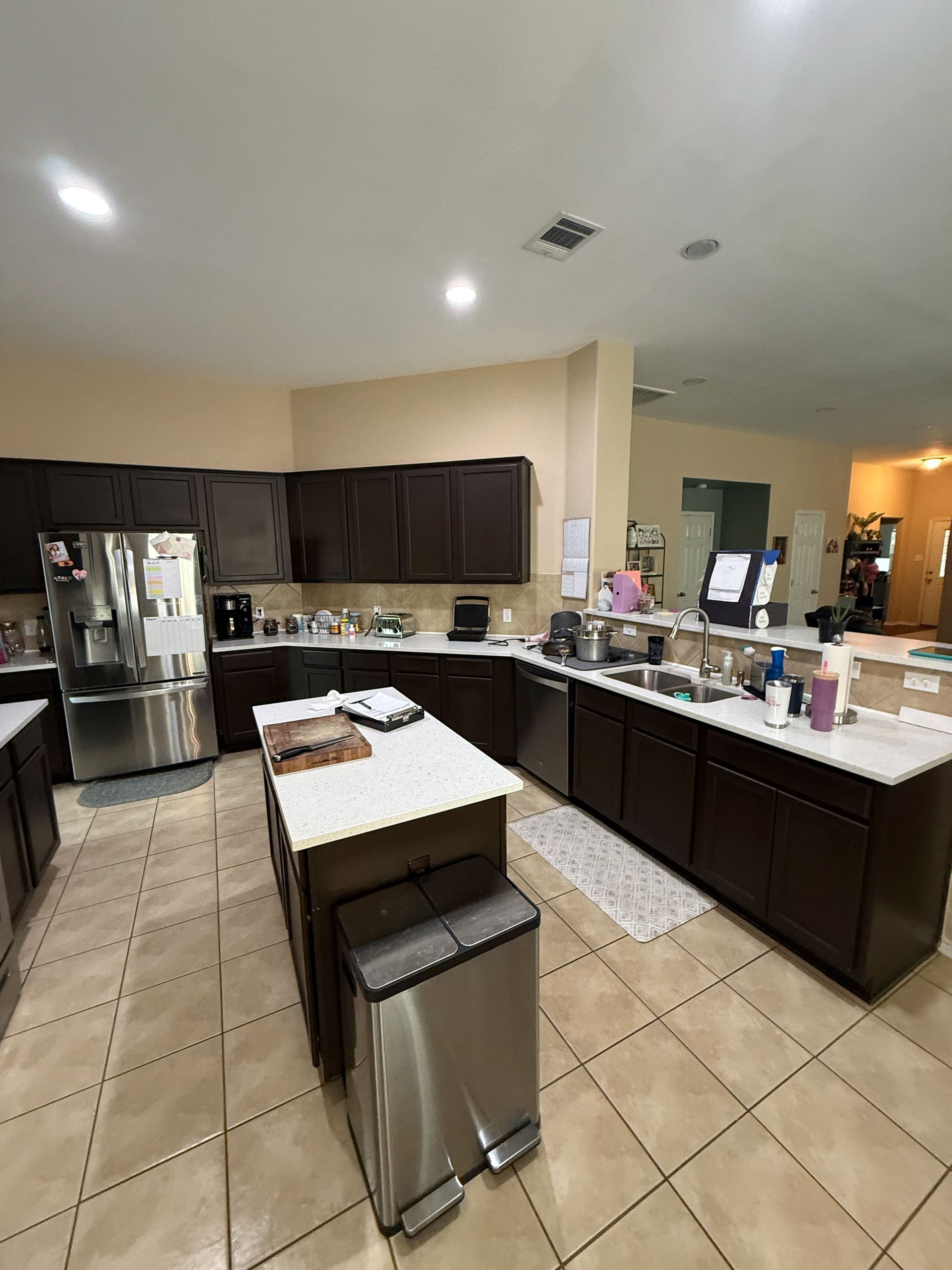 Leander kitchen before remodel with existing cabinets before Waterloo cabinet painting and new backsplash