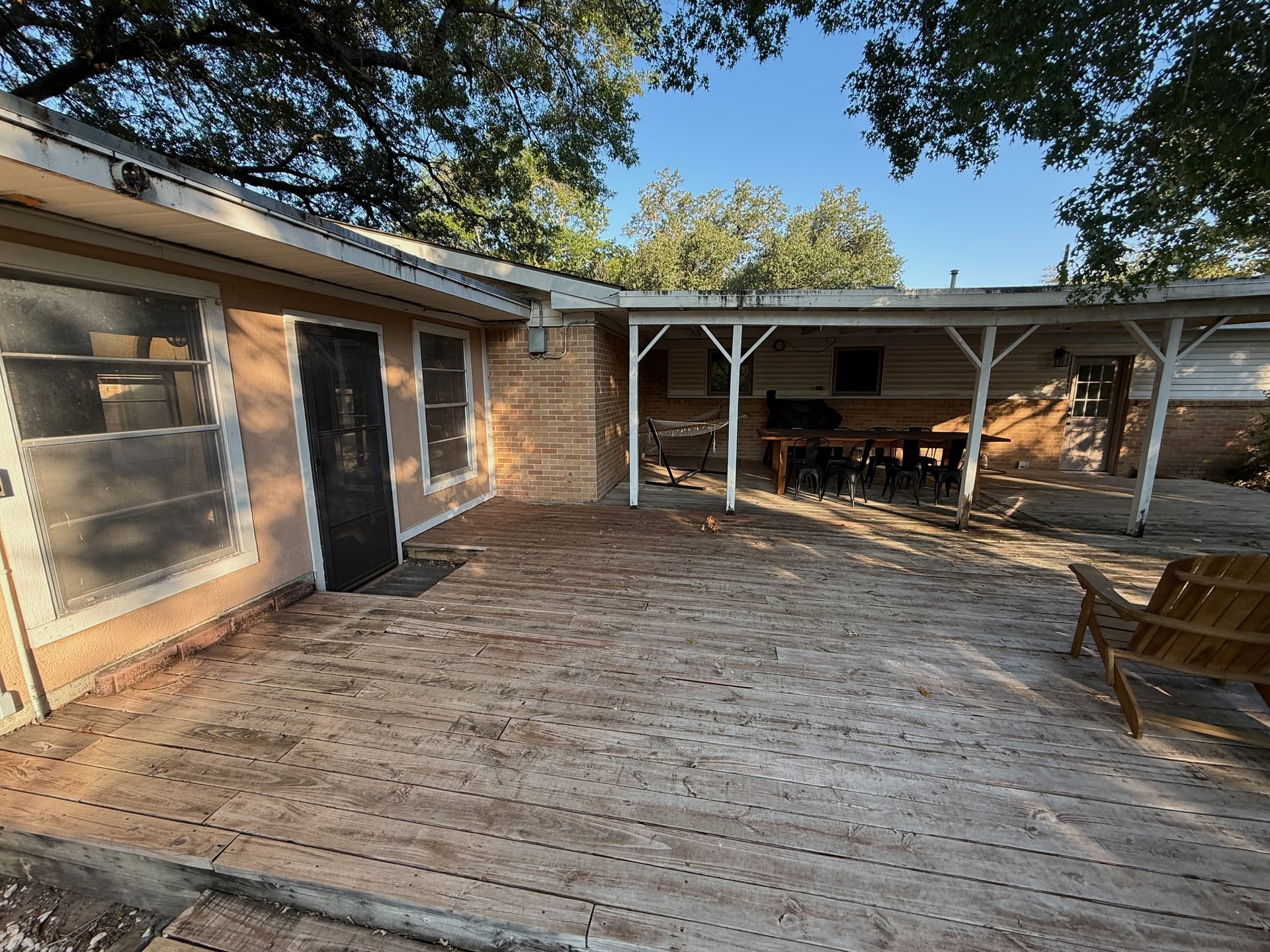North Austin exterior before painting brick siding and deck