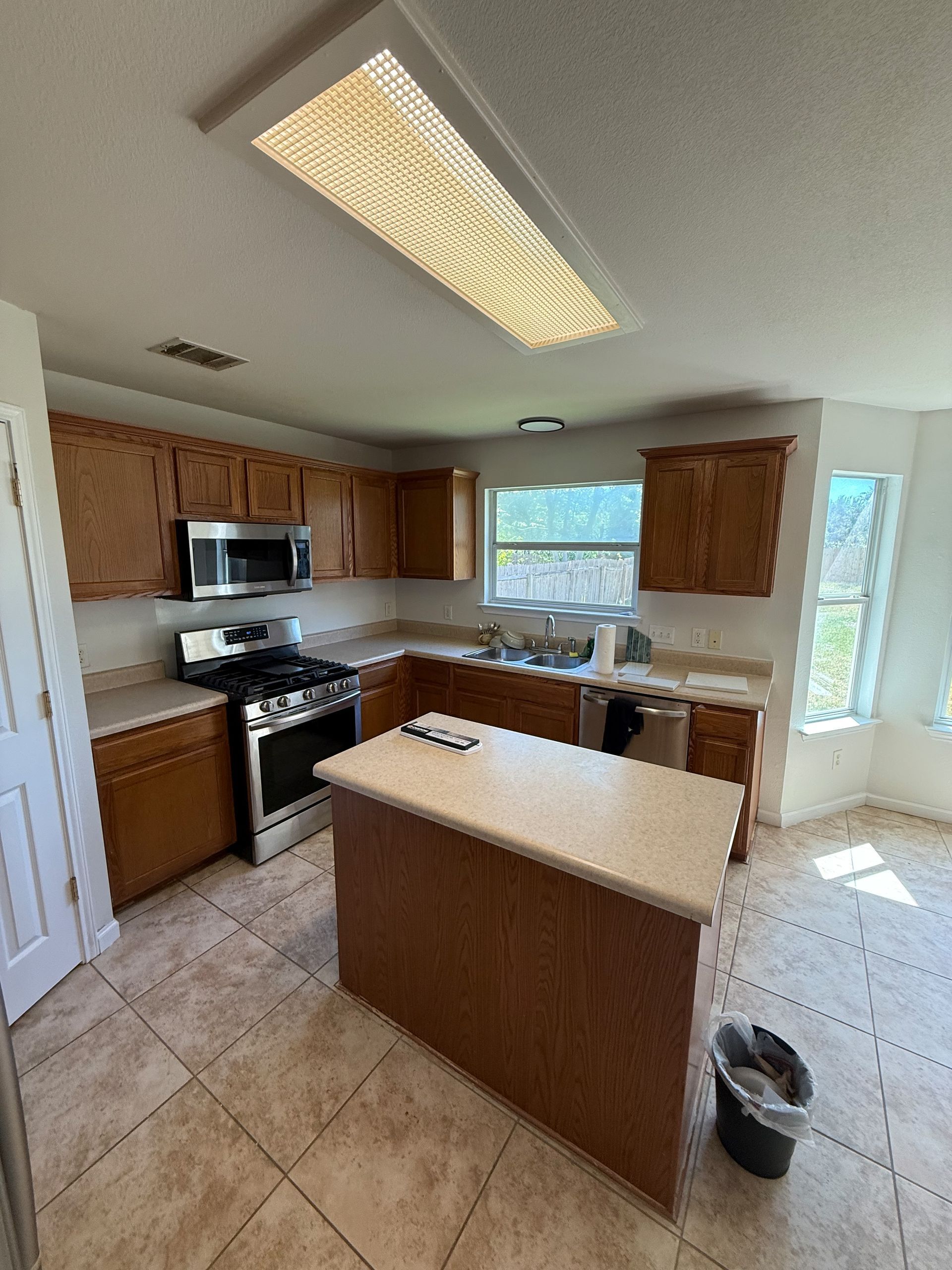 Avery Ranch kitchen before remodel with old cabinets and island