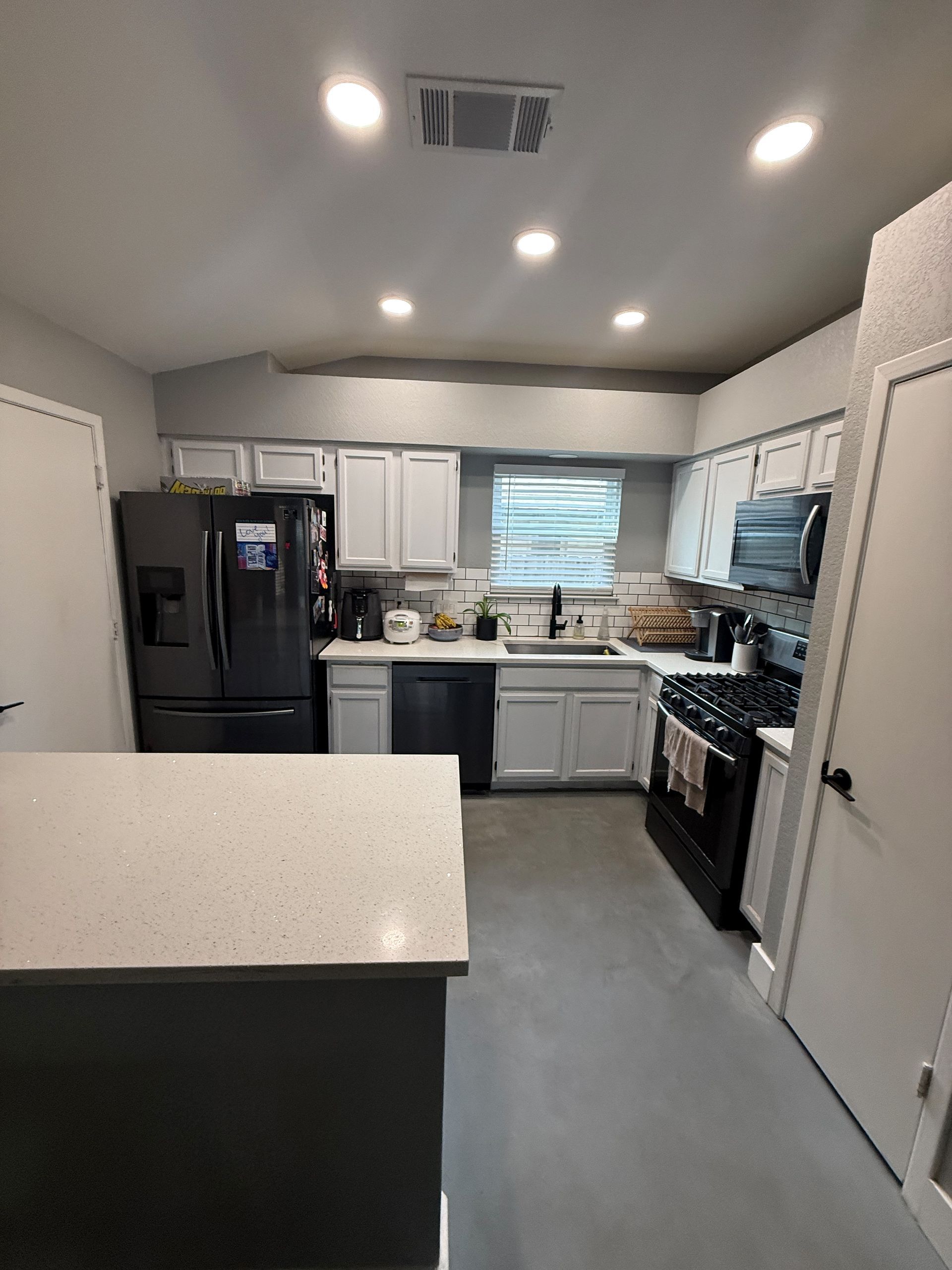 Northwest Austin kitchen before cabinet replacement quartz countertops and luxury vinyl flooring