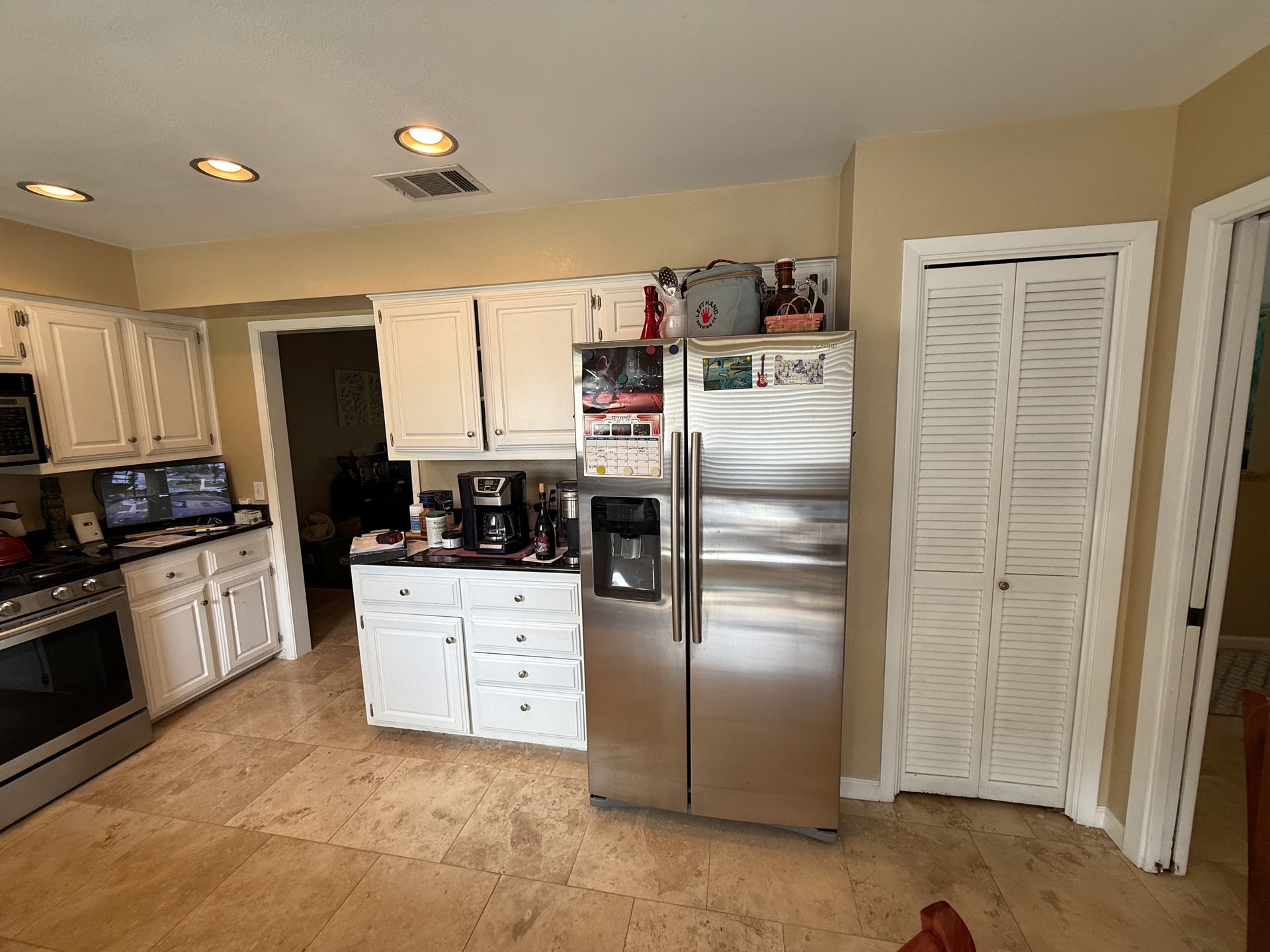 Northwest Austin kitchen before remodel showing existing cabinets and furdown above the upper cabinetry