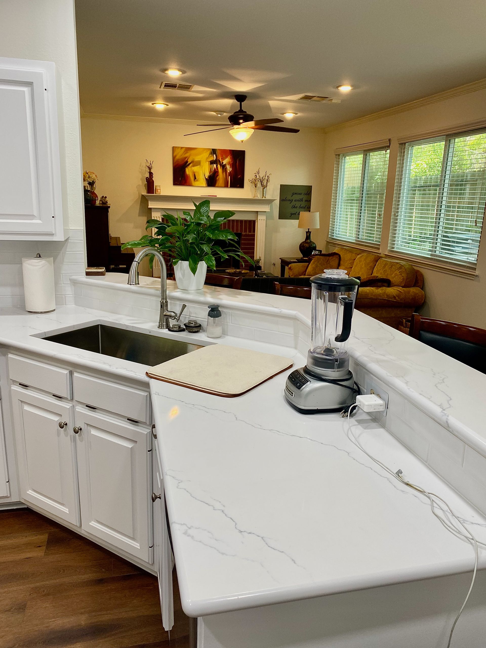 Northwest Austin kitchen remodel with painted cabinets quartz countertops and subway tile backsplash
