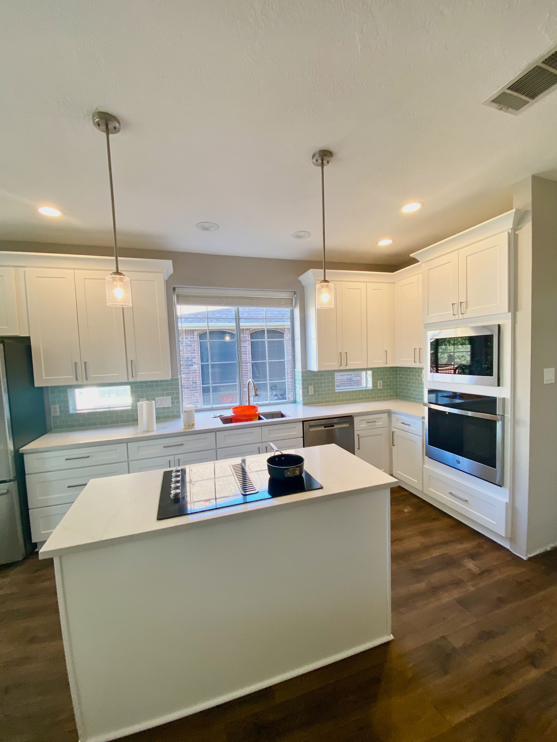 Northwest Austin kitchen remodel with new shaker cabinets quartz countertops and flooring