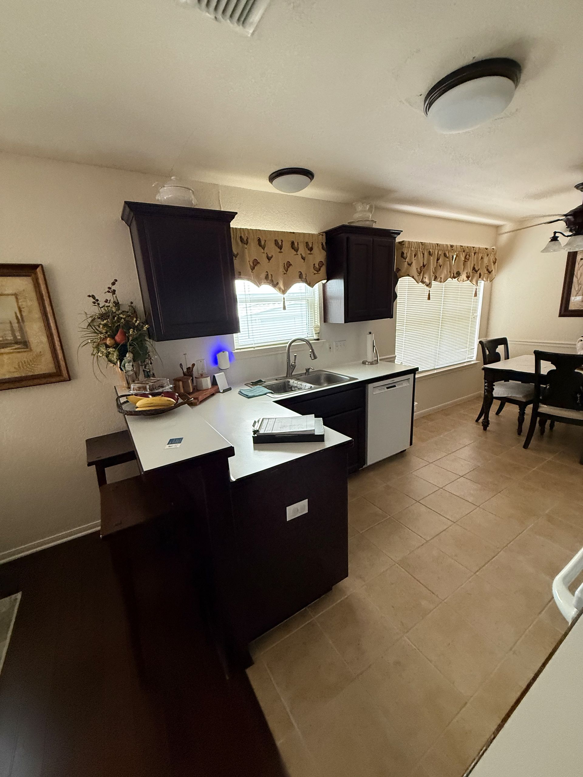 Round Rock small kitchen before remodel and replacement with white shaker cabinets