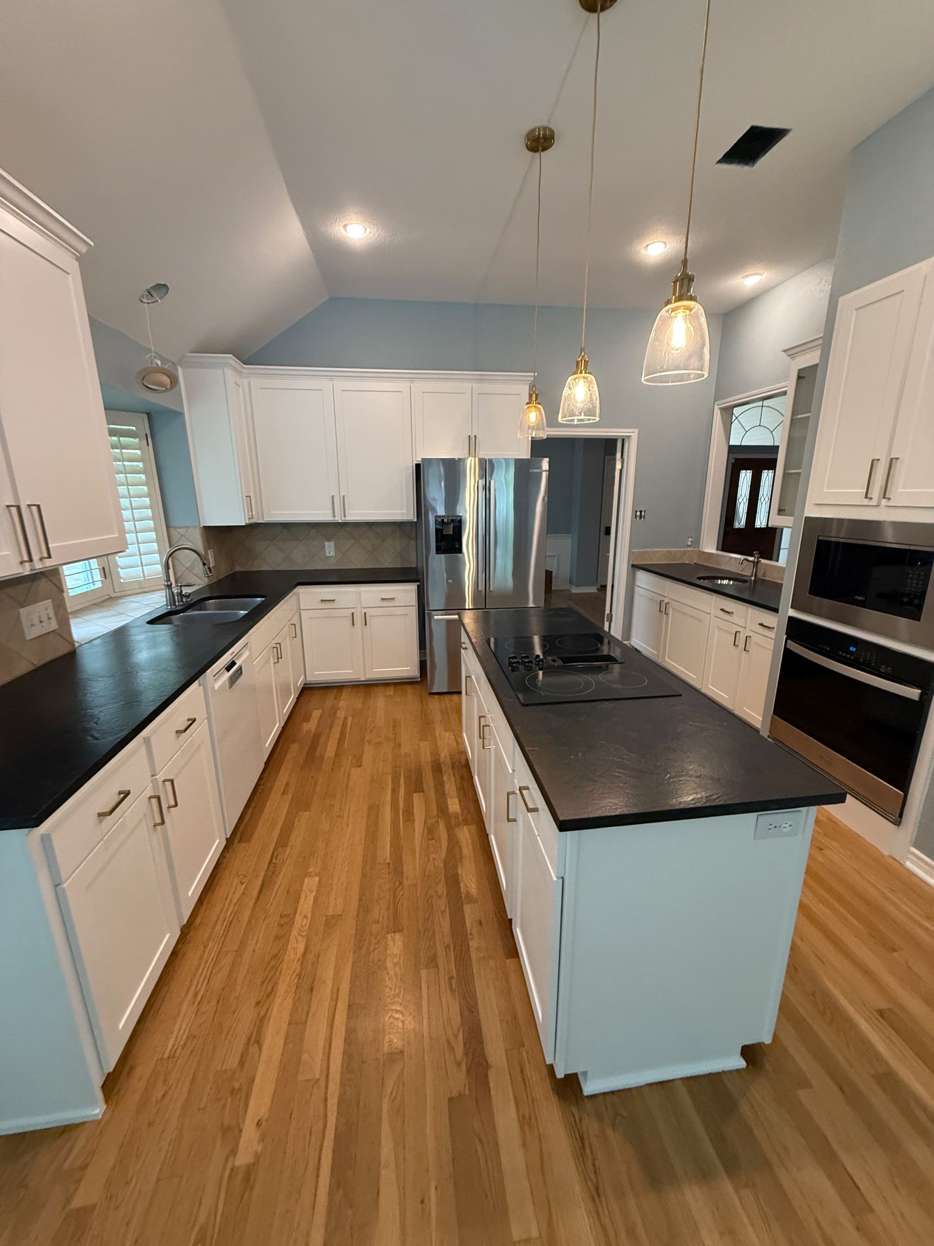 Southwest Austin kitchen after cabinet refacing with shaker doors and custom pullout storage