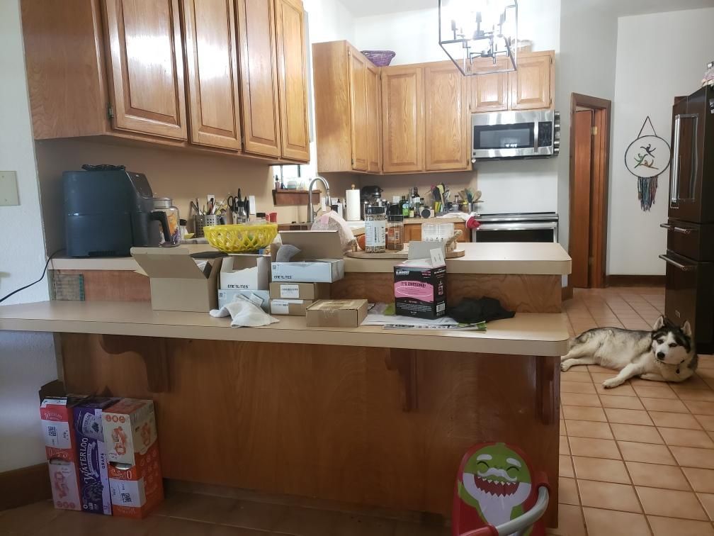 Spicewood kitchen before remodel with older cabinets and countertops