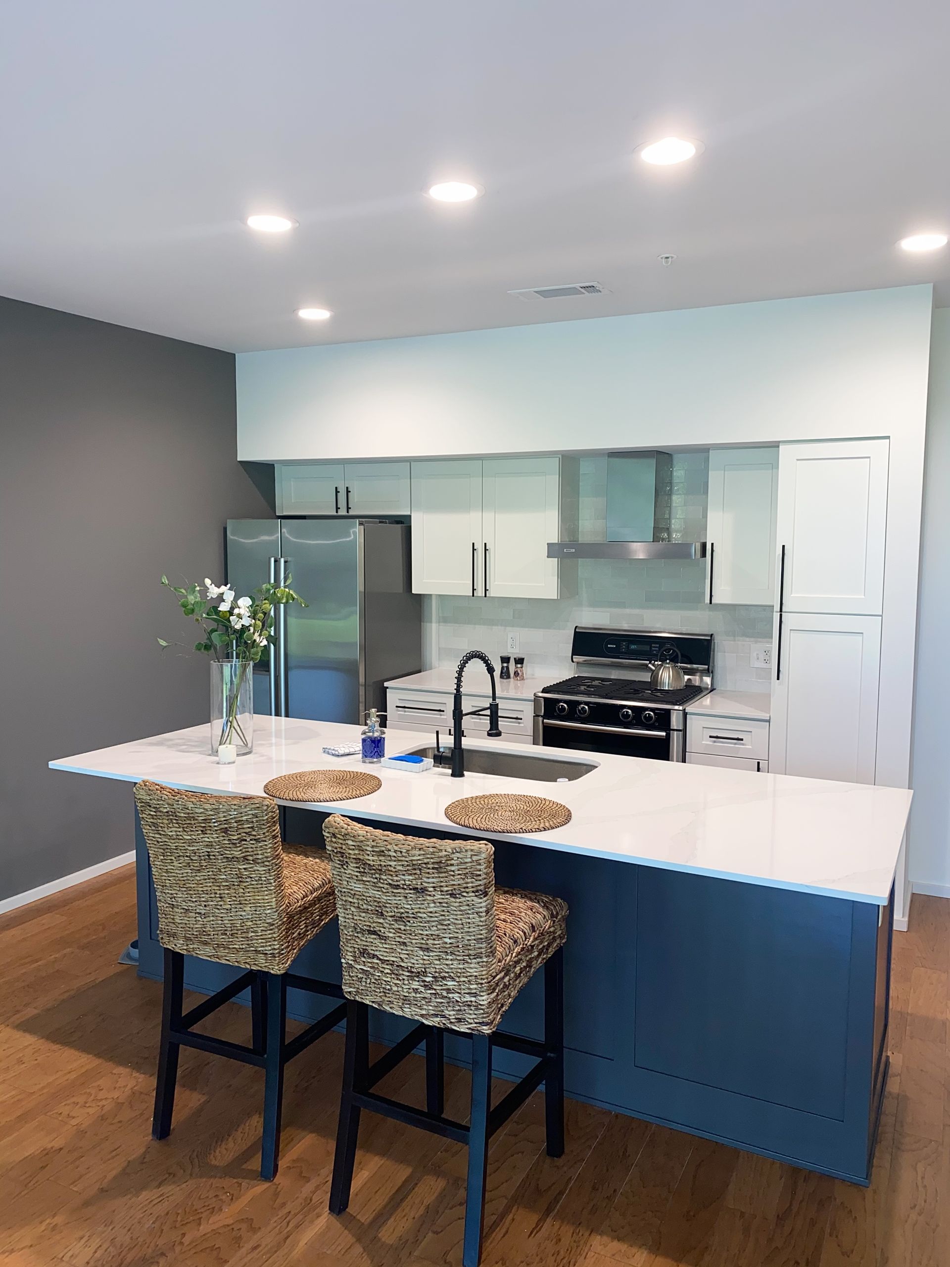 Austin kitchen remodel with shaker cabinets quartz countertops and backsplash