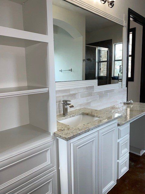 Home in Lake Travis area of Austin, TX that had whole house cabinet painting and cabinet staining completed by Austin Painting and Cabinets