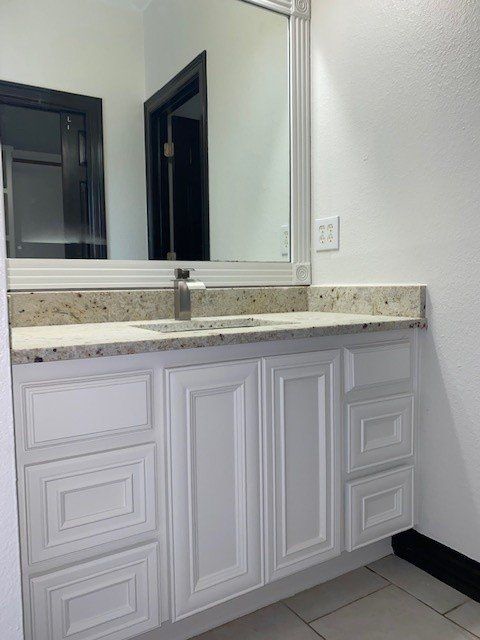 Home in Lake Travis area of Austin, TX that had whole house cabinet painting and cabinet staining completed by Austin Painting and Cabinets