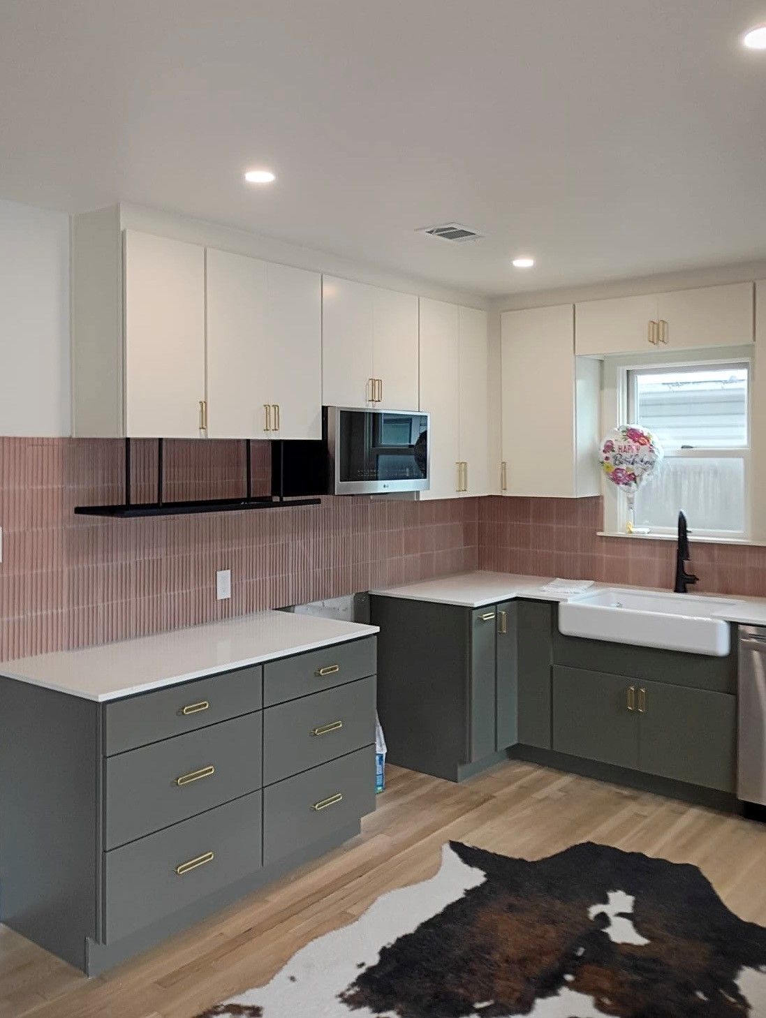 Kitchen remodel in downtown Austin, TX including new cabinets, cabinet painting, new countertops, new backsplash