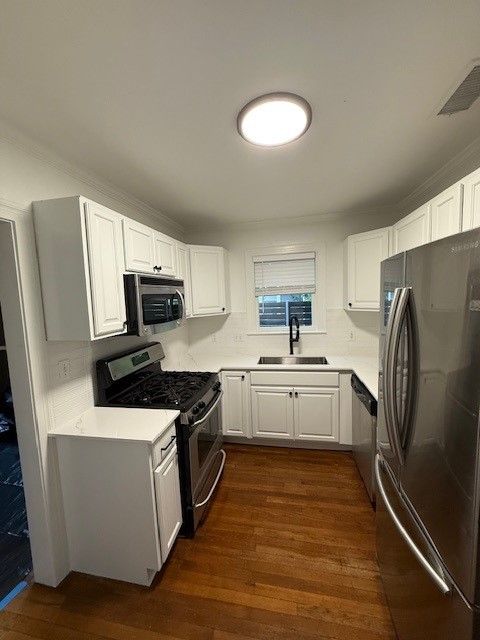 Kitchen remodel in downtown Austin, TX including cabinet painting, new countertops, new backsplash