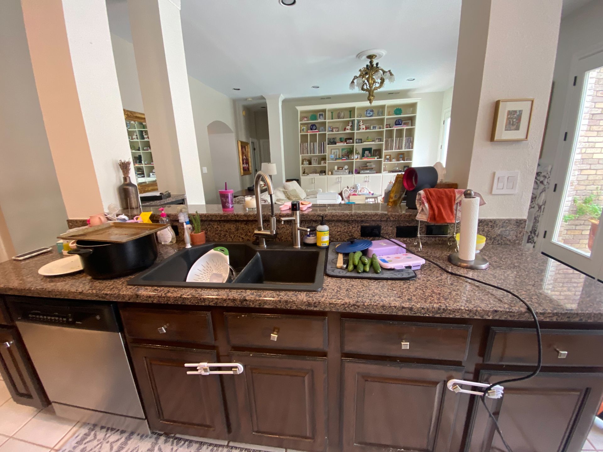 River Place Austin kitchen before remodel with pillars behind island