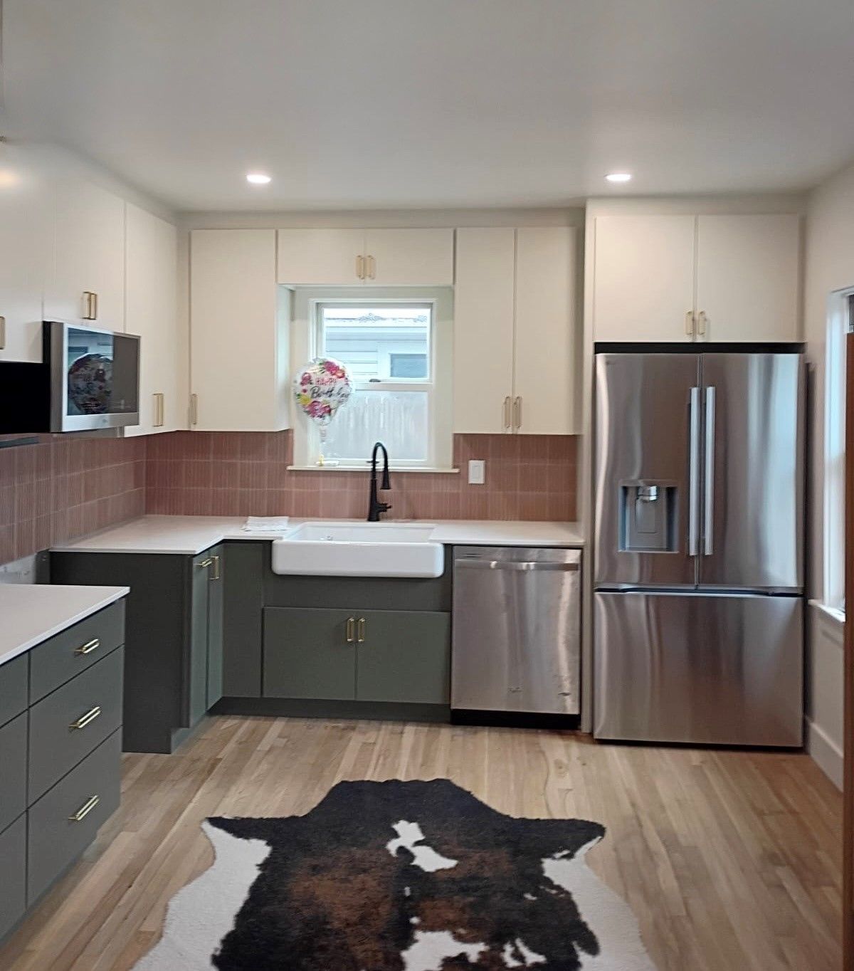 Kitchen remodel in downtown Austin, TX including new cabinets, cabinet painting, new countertops, new backsplash
