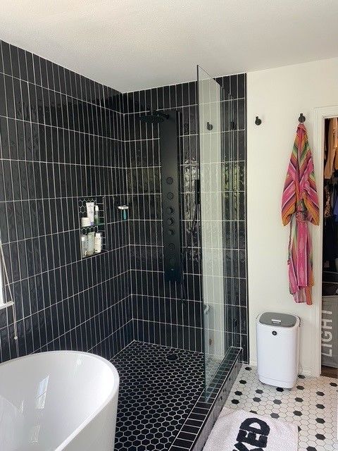 bathroom remodel in austin tx including new shower, tub, and vanity