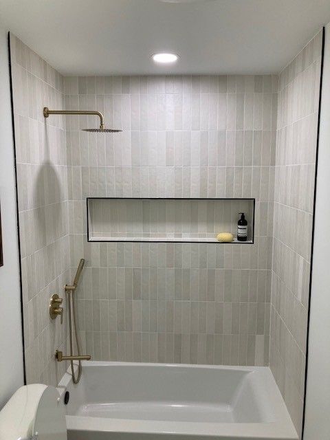 bathroom remodel in austin tx with new tub surround tile with custom niche