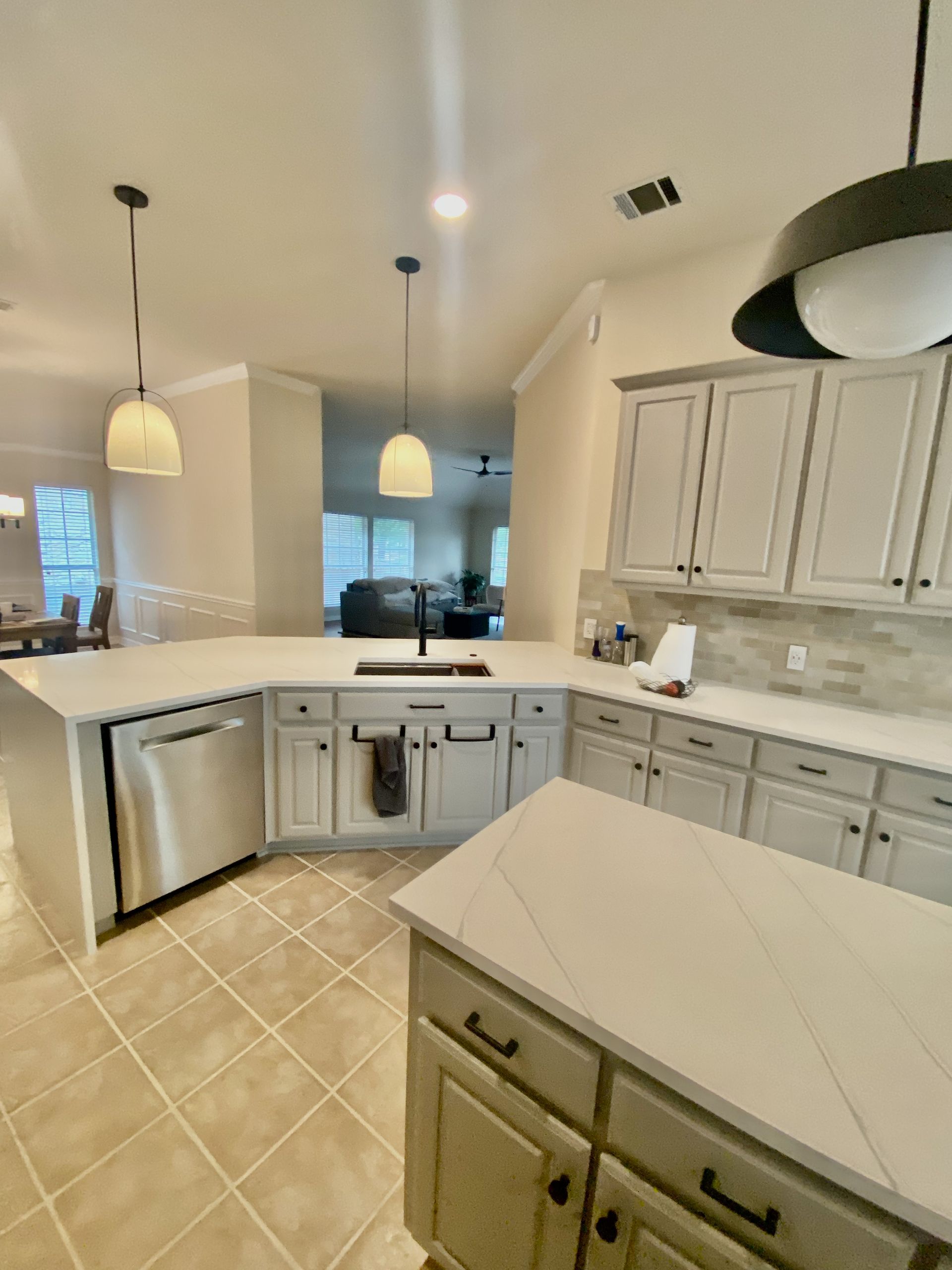 Austin kitchen remodel with waterfall quartz countertops and updated layout in Canyon Creek