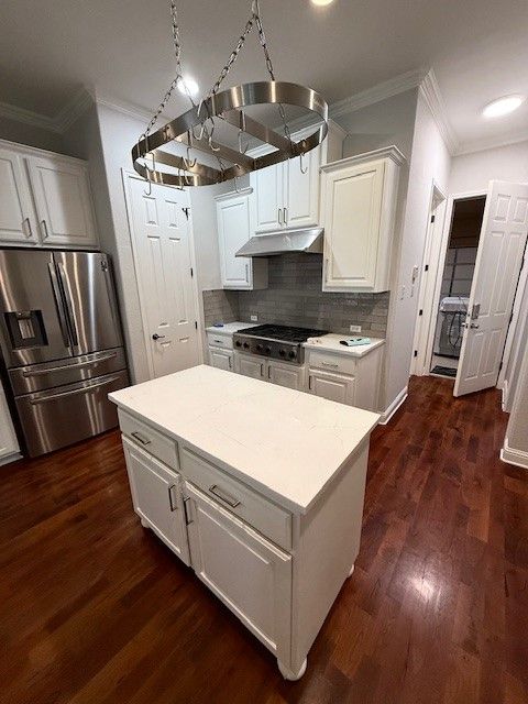 Kitchen remodel in Cedar Park, TX including cabinet painting, new countertops, new backsplash