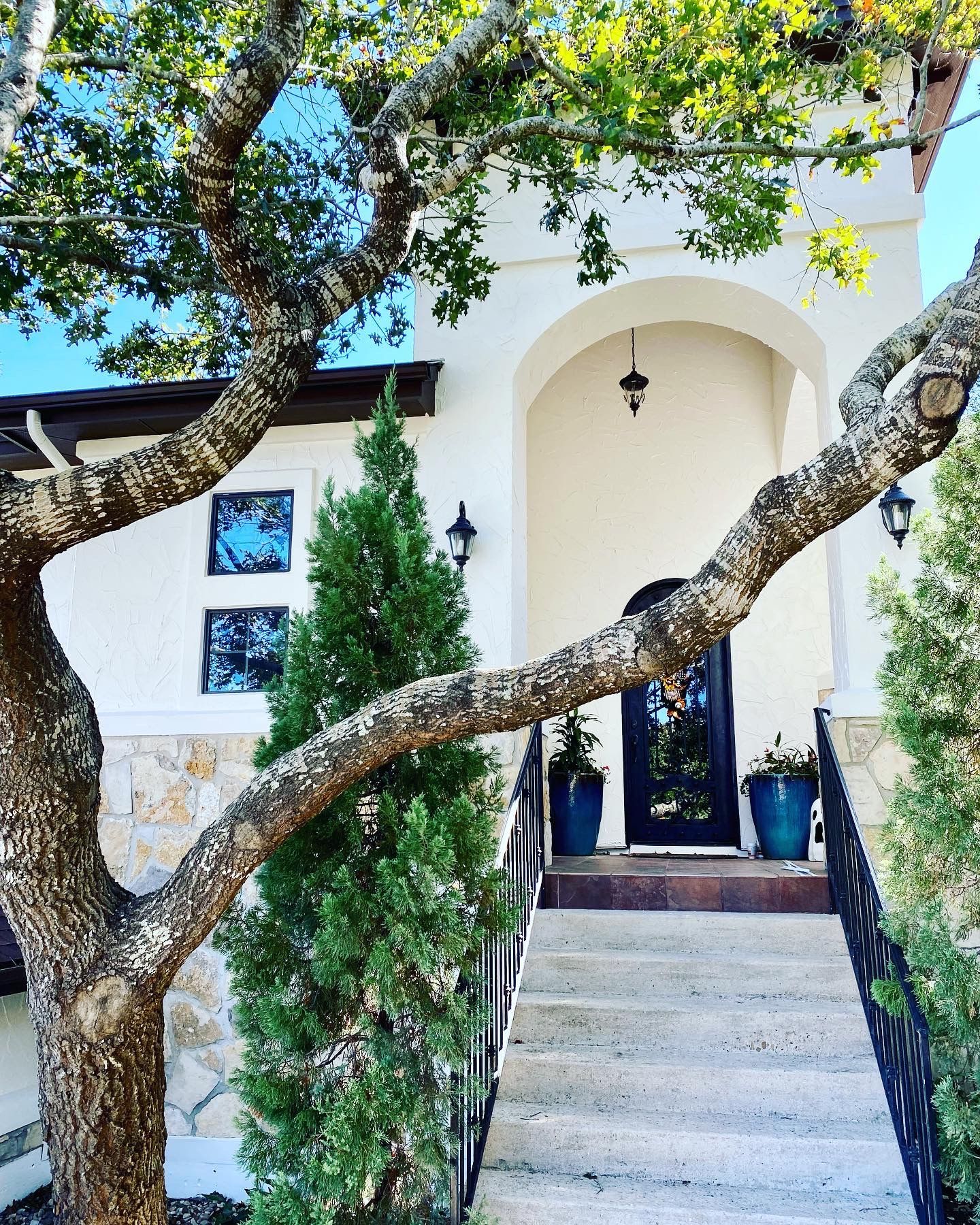 Exterior painting in Lakeway including stucco trim doors and deck staining