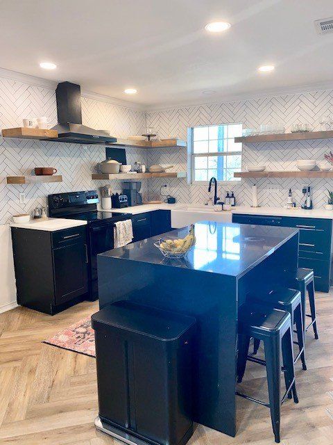 Home in Lake Travis area of Austin, TX that had full kitchen remodel including new cabinets, new countertops, new backsplash, and whole house interior painting and exterior painting completed by Austin Painting and Cabinets