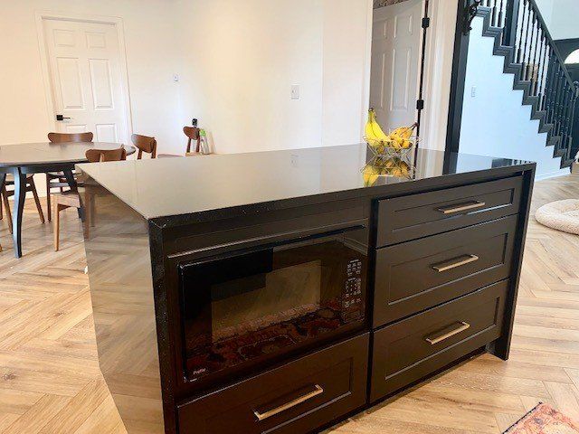 Home in Lake Travis area of Austin, TX that had full kitchen remodel including new cabinets, new countertops, new backsplash, and whole house interior painting and exterior painting completed by Austin Painting and Cabinets