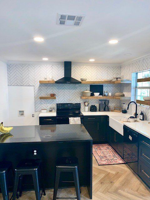 Home in Lake Travis area of Austin, TX that had full kitchen remodel including new cabinets, new countertops, new backsplash, and whole house interior painting and exterior painting completed by Austin Painting and Cabinets