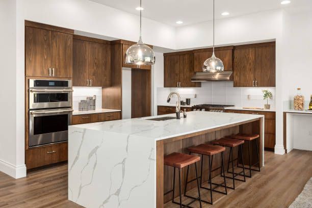 Kitchen island design ideas for Austin kitchen remodels with quartz countertops and seating